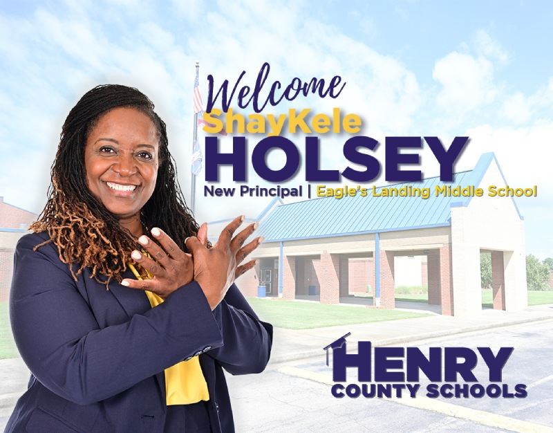 Holsey, printed welcome message, and HCS logo with faded photo of ELMS as background.